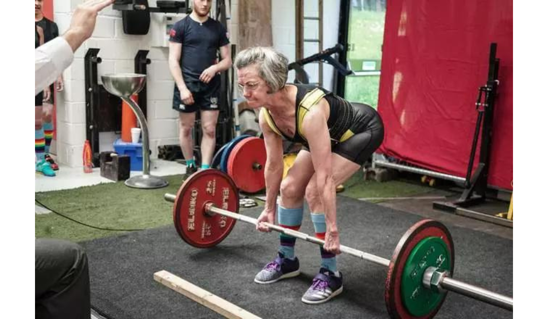 Older woman lifting a barbell