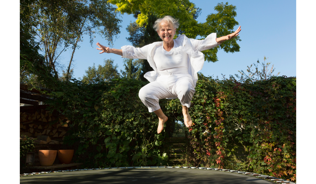 older lady jumping on trampoline