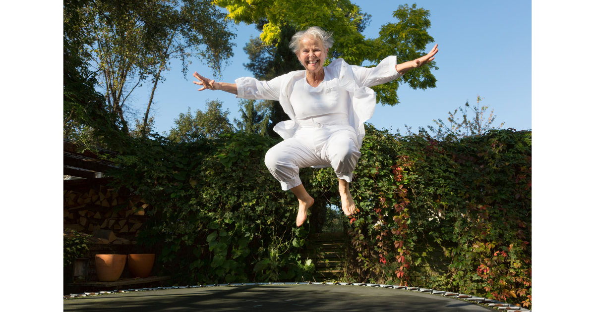 older lady jumping on trampoline