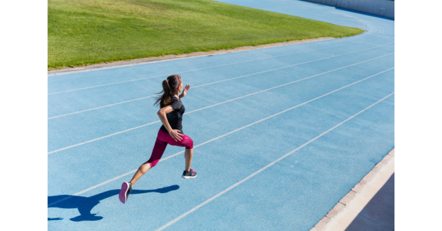 woman sprinting on a track 