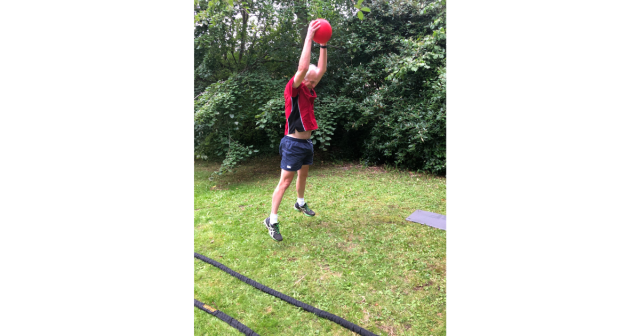 Edward performing slam ball jumps in park