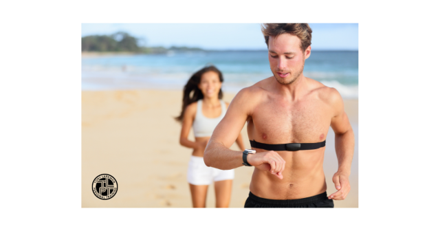 Runner using heart rate monitor during outdoor endurance training