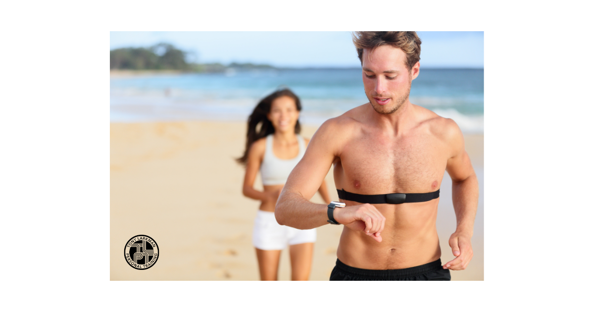 Runner using heart rate monitor during outdoor endurance training