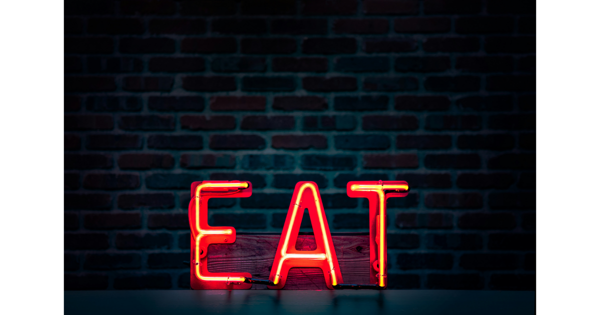 Neon sign representing intermittent fasting and meal timing