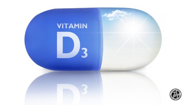Illustration of a large blue and white vitamin D3 capsule with sunlight shining through it, representing vitamin D supplementation during autumn and winter.