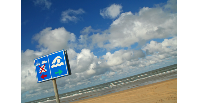 swimming safety signs on a beach