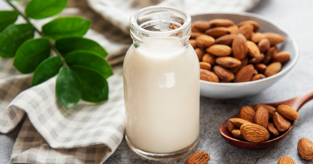 bottle of almond nut milk and almonds