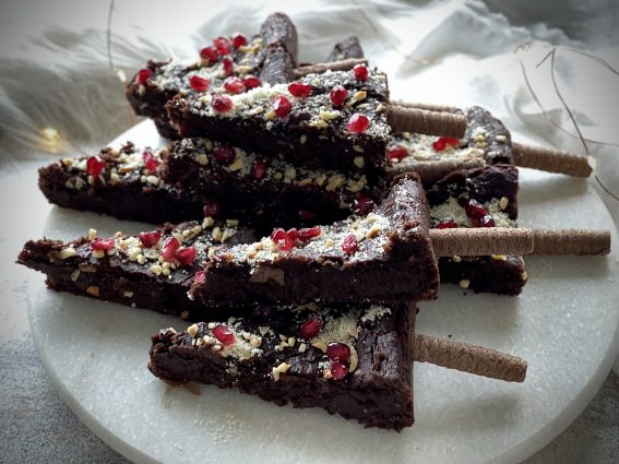 Christmas tree brownies lying on a white plate