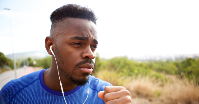 man listening to music whilst running