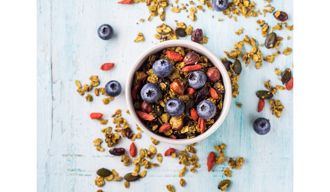 bowl of nutty granola and blueberries