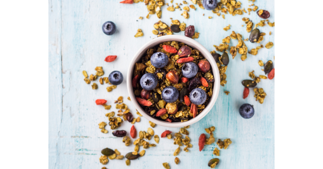 bowl of nutty granola and blueberries